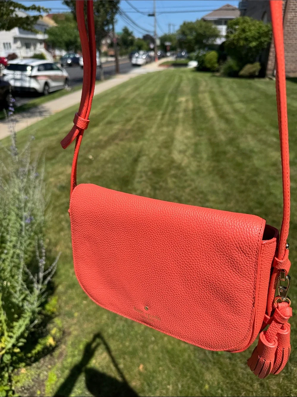 kate spade coral orange pebbled leather crossbody with tassels
